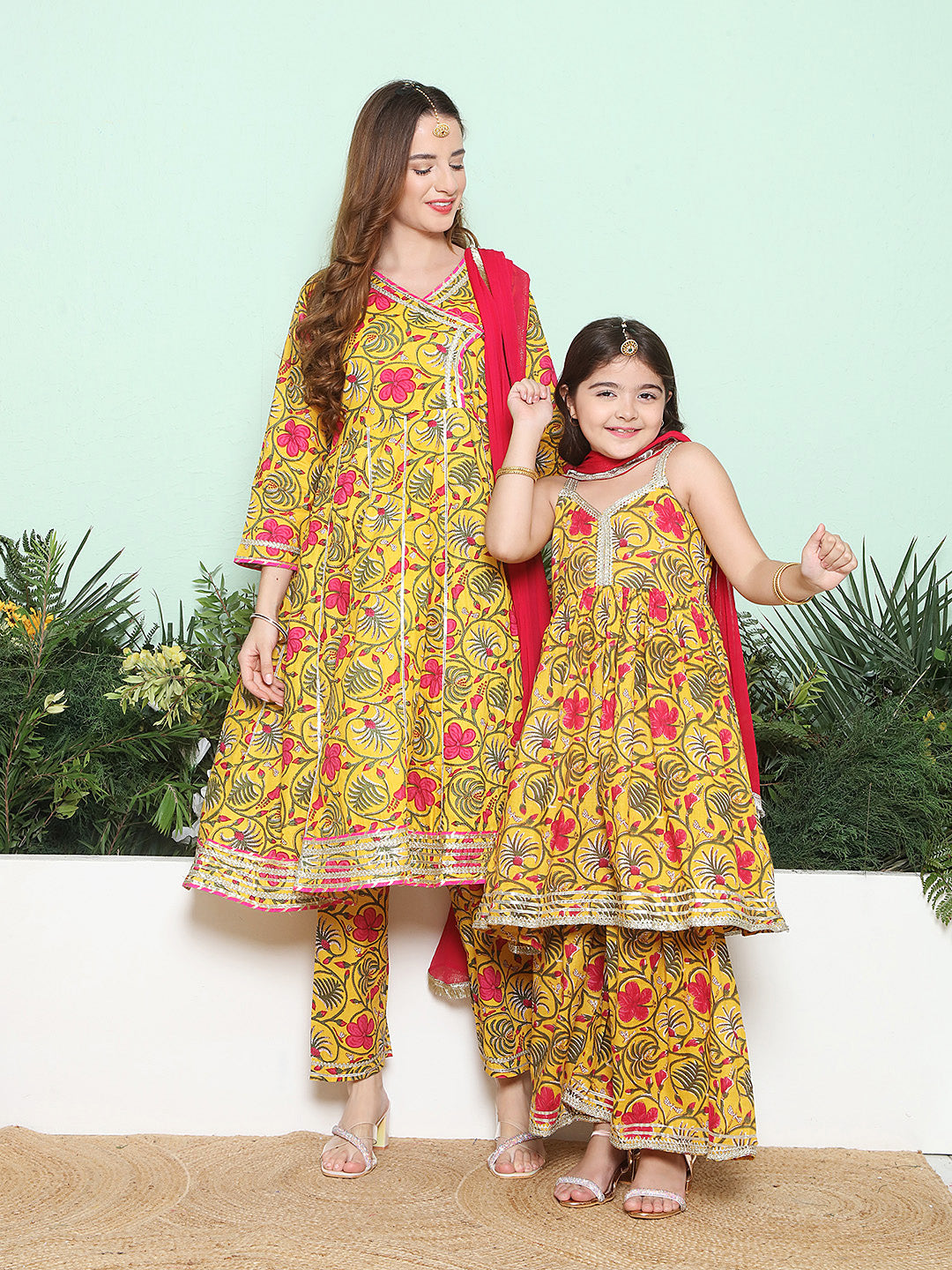Yellow Pink Cotton Printed Anarkali Angrakha Kurta set For Women & Flared Sharara Kurta Set For Girl.
