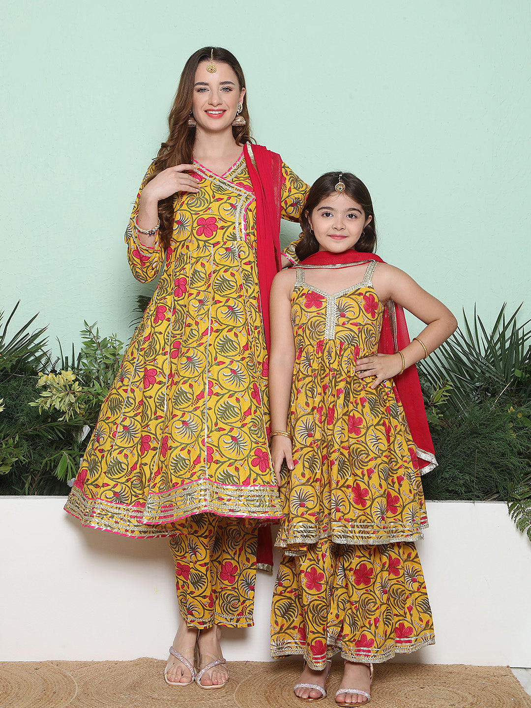 Yellow Pink Cotton Printed Anarkali Angrakha Kurta set For Women & Flared Sharara Kurta Set For Girl.