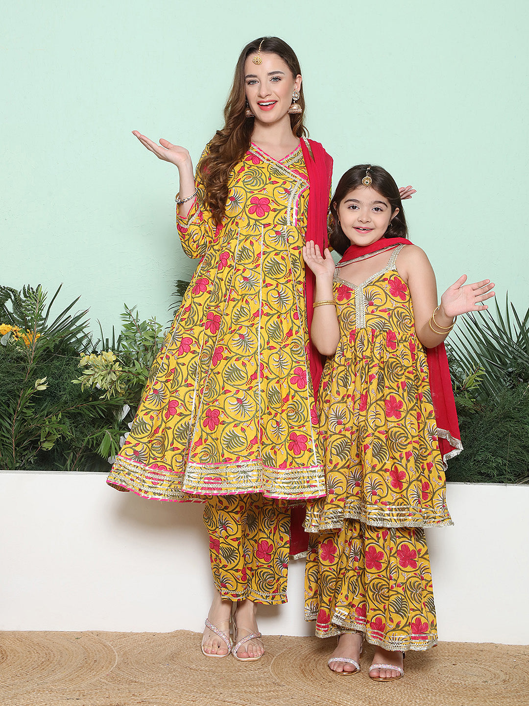 Yellow Pink Cotton Printed Anarkali Angrakha Kurta set For Women & Flared Sharara Kurta Set For Girl.