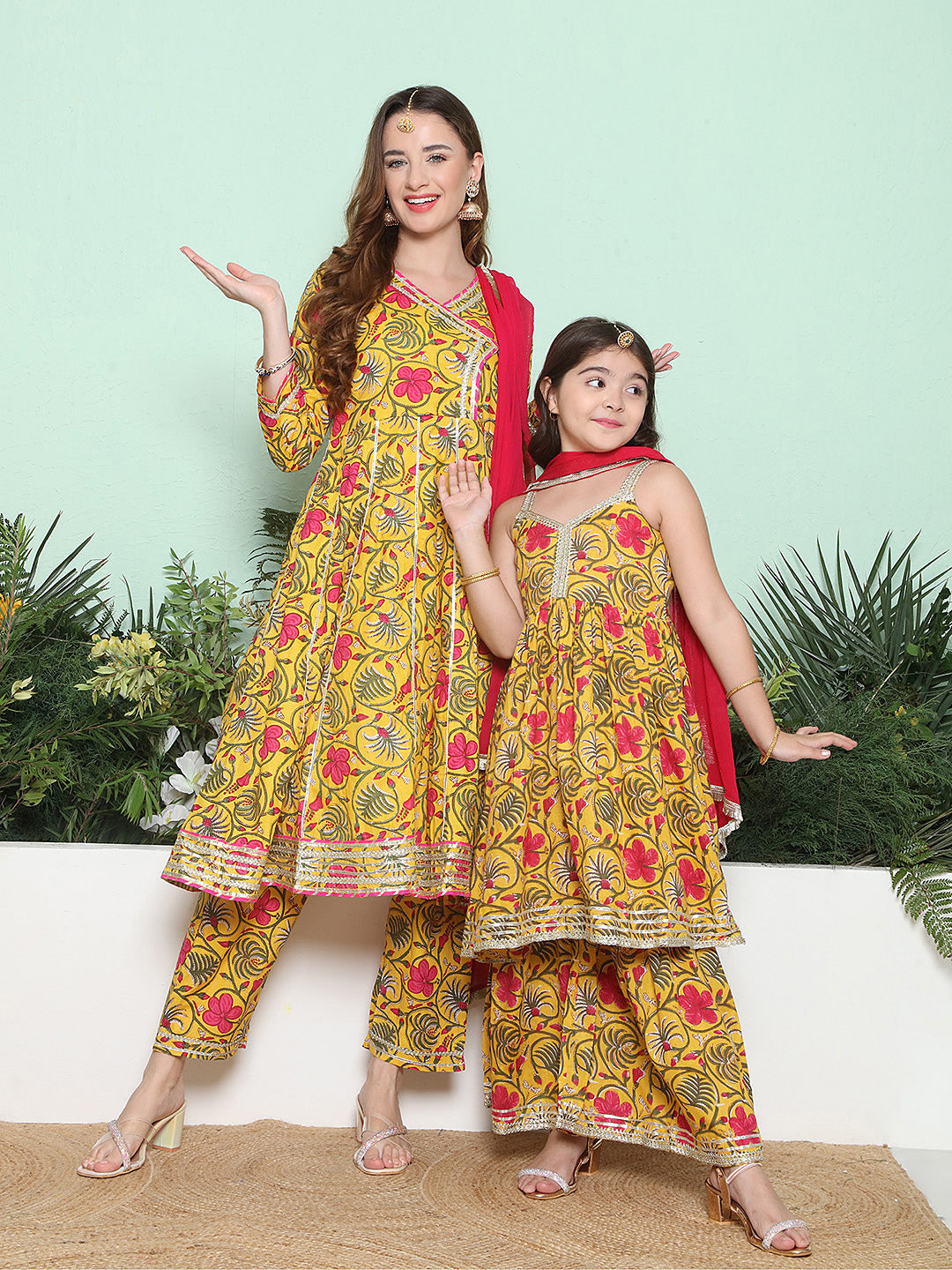 Yellow Pink Cotton Printed Anarkali Angrakha Kurta set For Women & Flared Sharara Kurta Set For Girl.