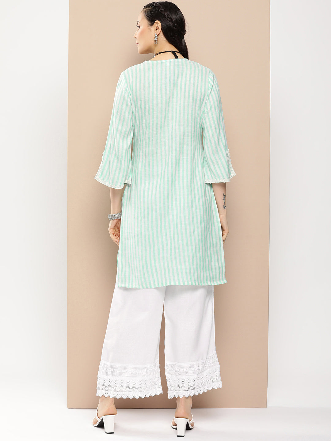 Bhama Couture Sea Green And White Striped Kurta With Lace Detailing & Off White Palazzos.
