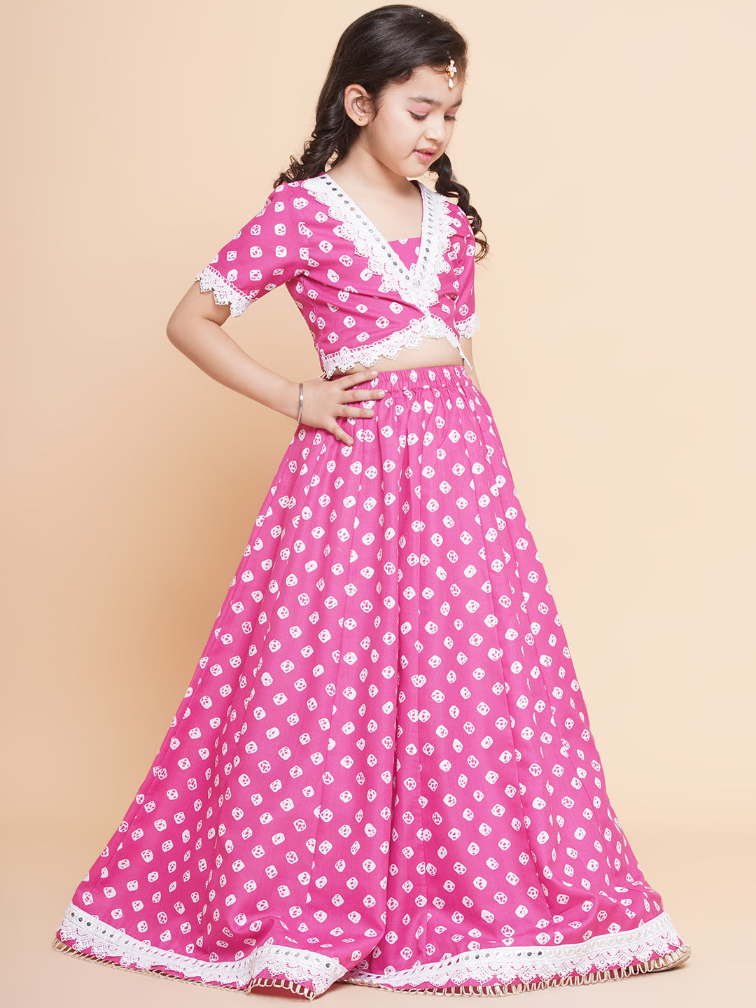 Bitiya By Bhama Girls Pink Bandhani Printed Lace Work Choli With Lehenga.