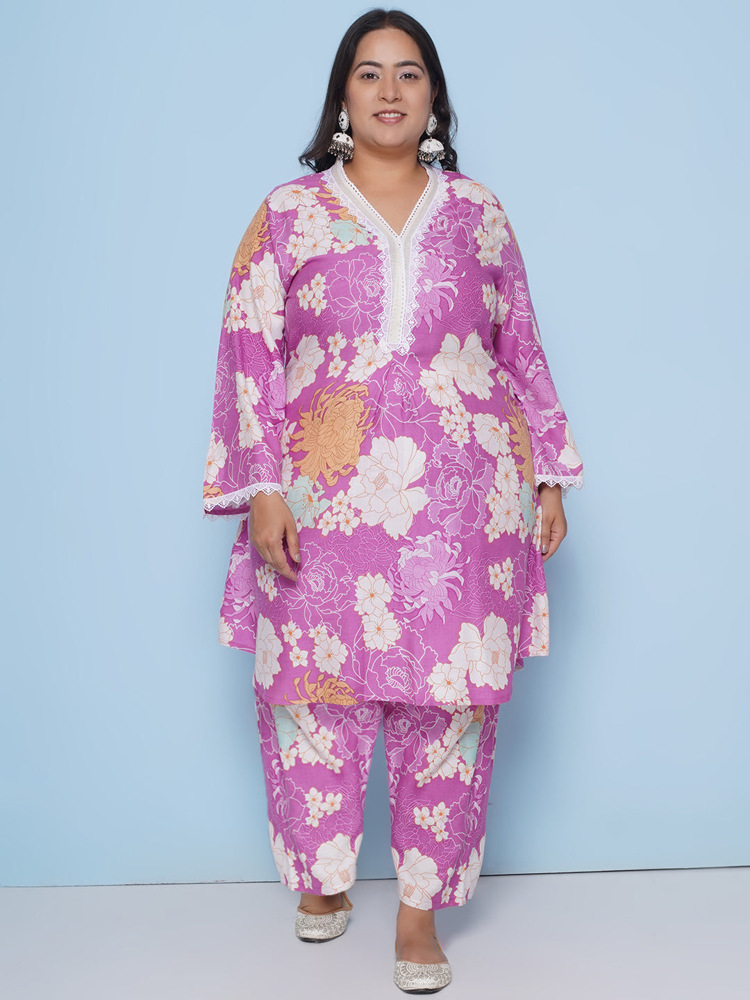 Purple color floral print kurta with lace detailing on sleeves and neck with Purple floral print pant
