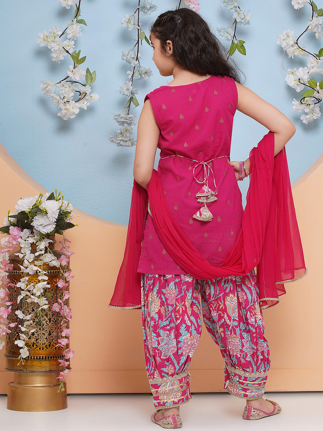 Pink Floral Printed style kurta has a Round-neck sleeveless , Above knee length with  straight hem, Elasticated waistband Afghani salwar with dupatta .