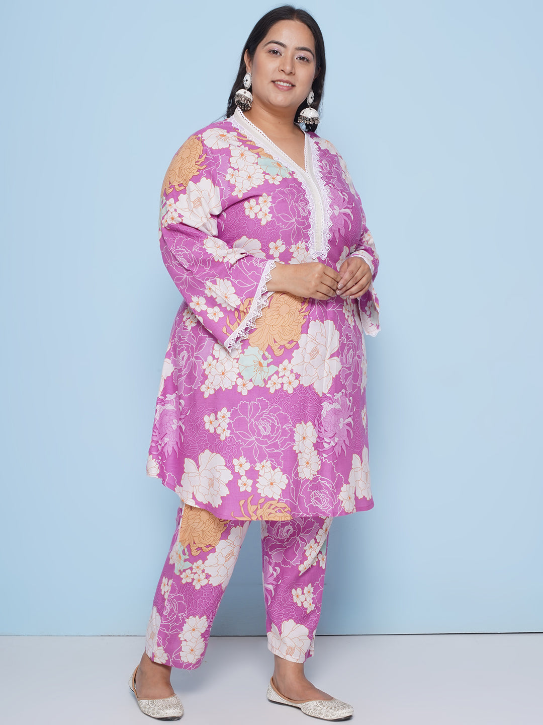 Purple color floral print kurta with lace detailing on sleeves and neck with Purple floral print pant