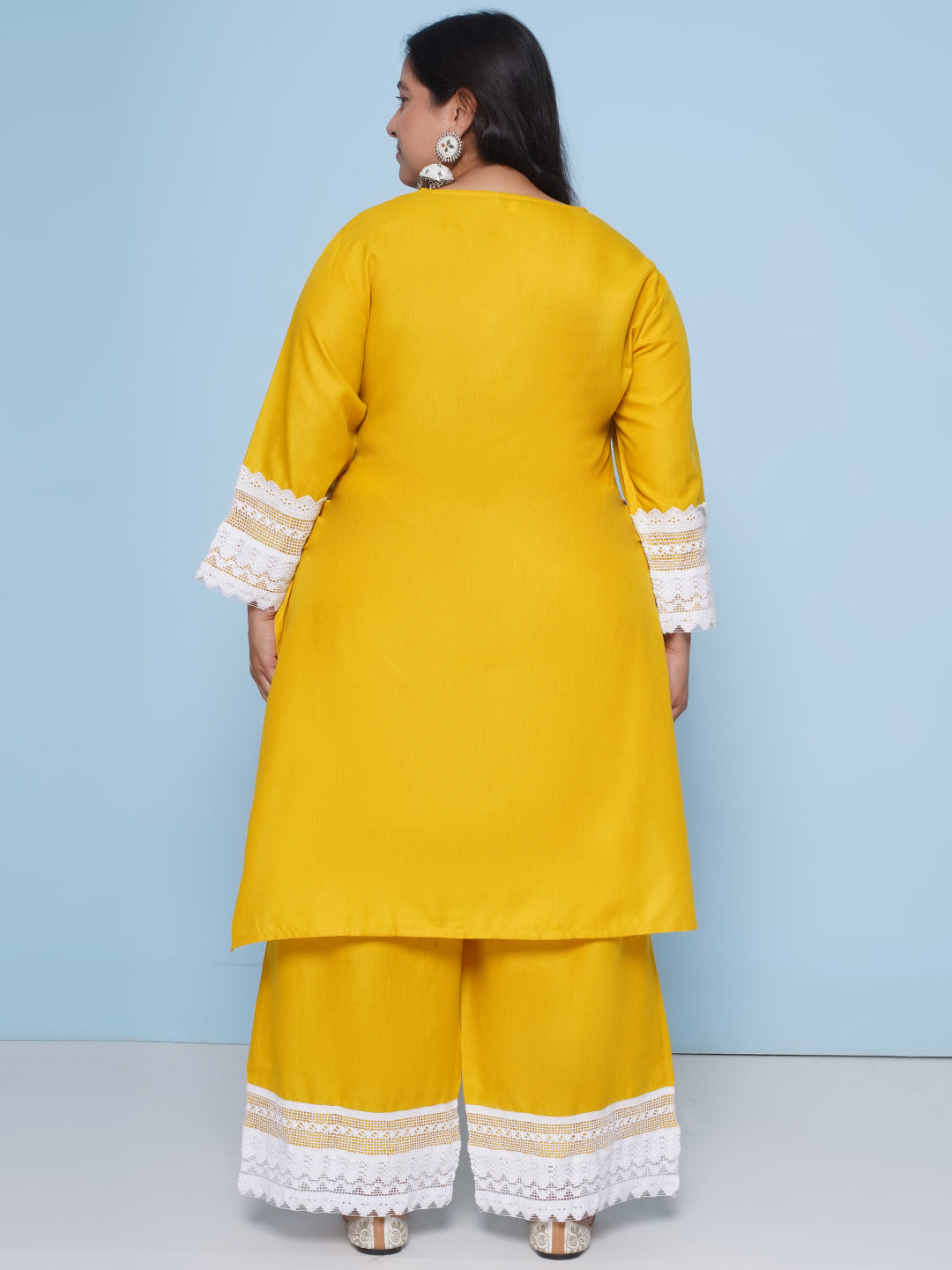 Yellow color kurta with lace detailing on sleeves and neck