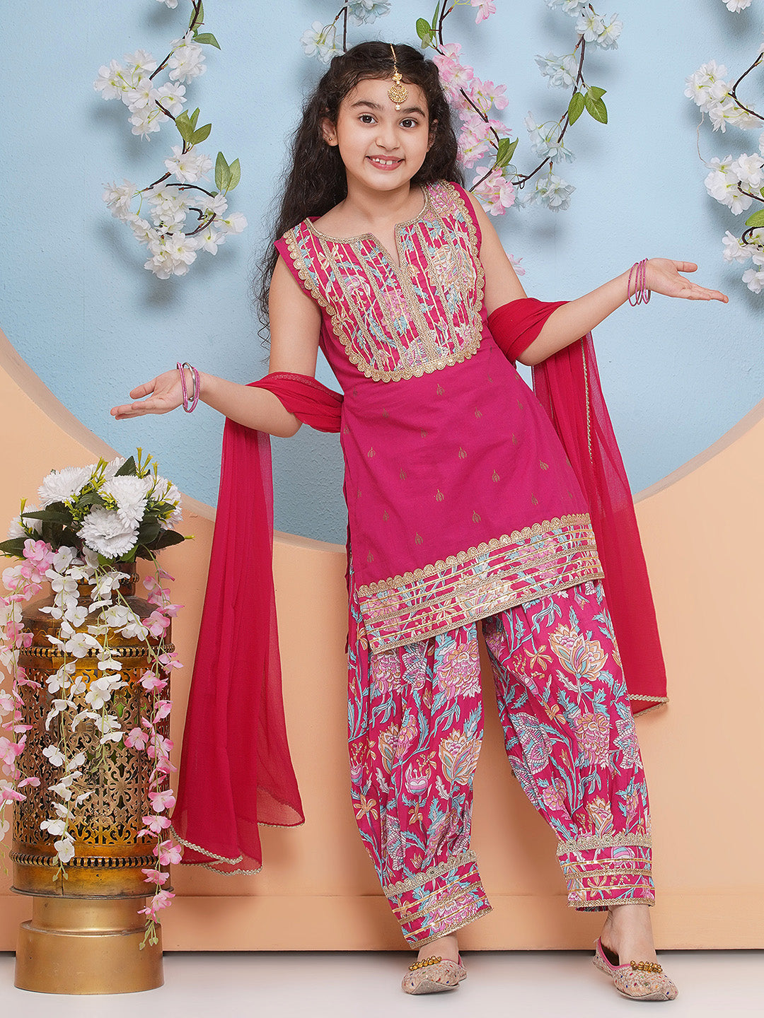 Pink Floral Printed style kurta has a Round-neck sleeveless , Above knee length with  straight hem, Elasticated waistband Afghani salwar with dupatta .