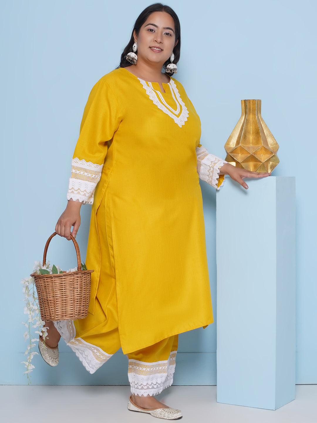 Yellow color kurta with lace detailing on sleeves and neck
