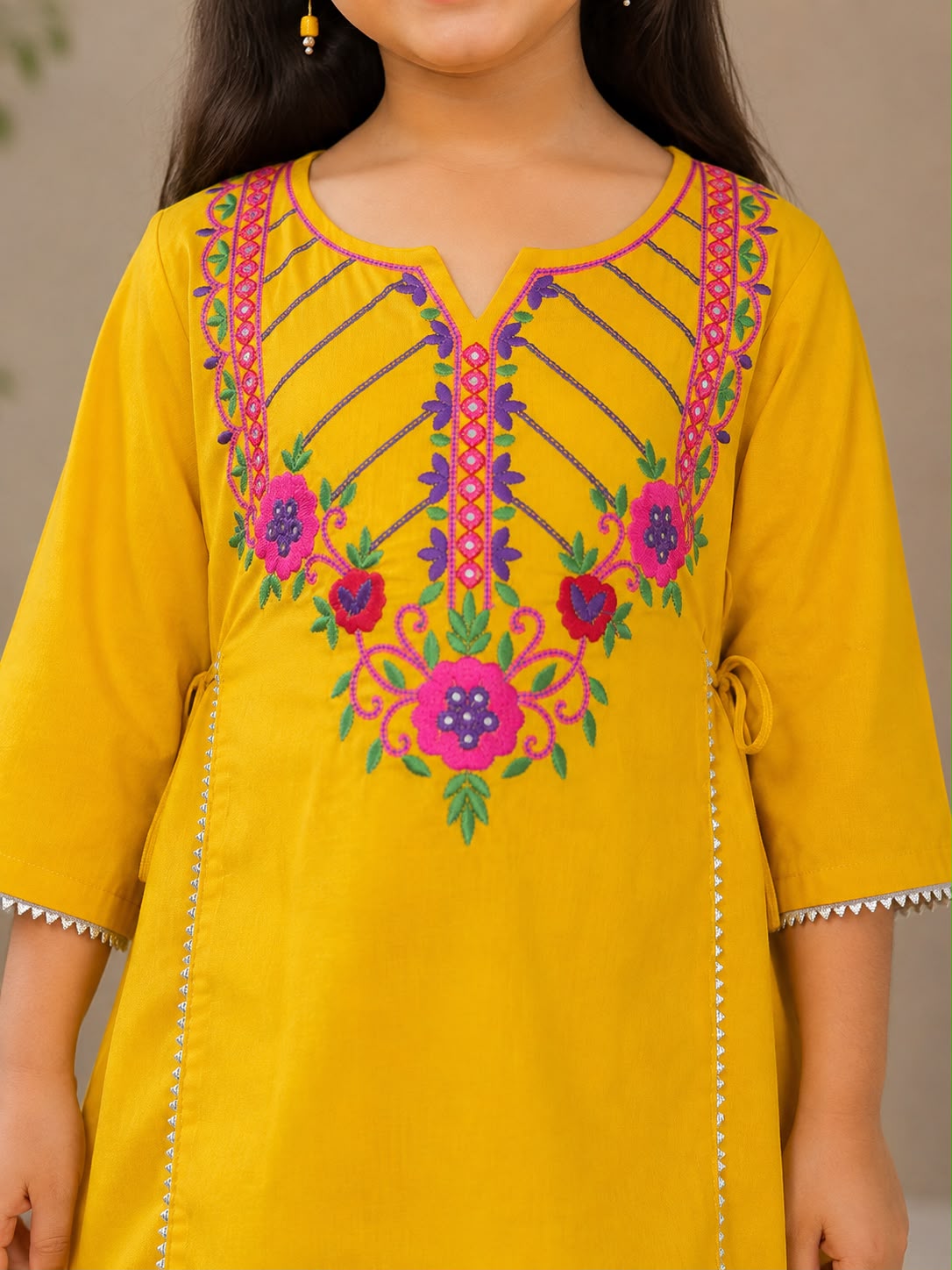 Bitiya By Bhama Girls Mustard Embroidered Kurta With Purple Dhoti set.