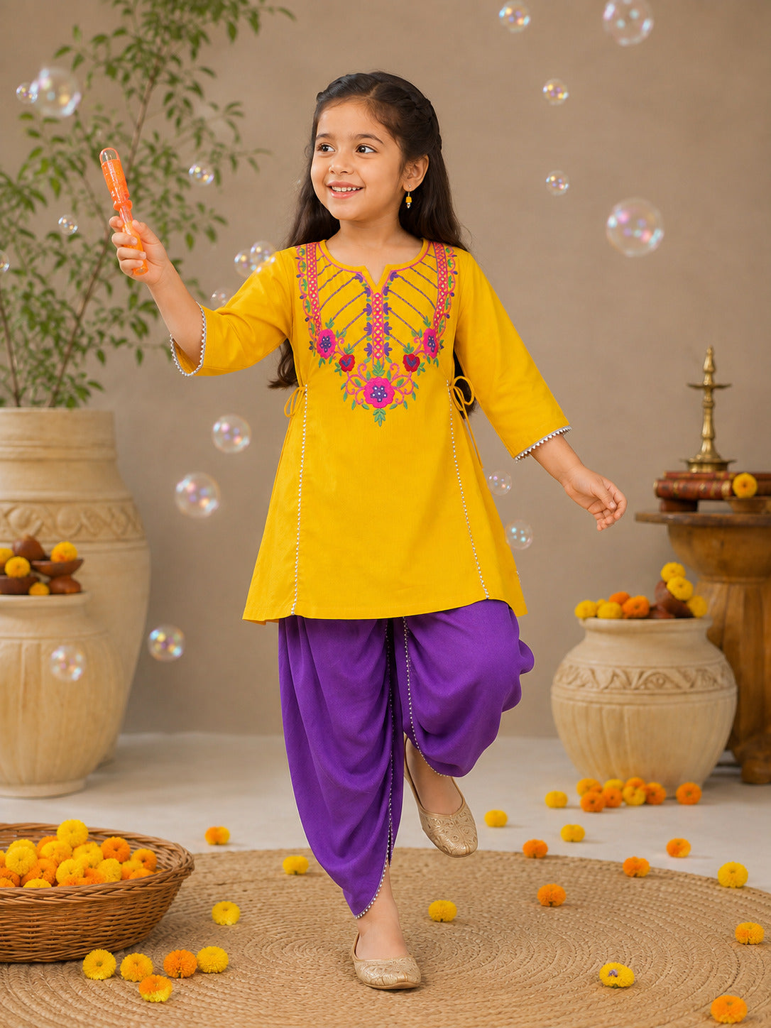Bitiya By Bhama Girls Mustard Embroidered Kurta With Purple Dhoti set.