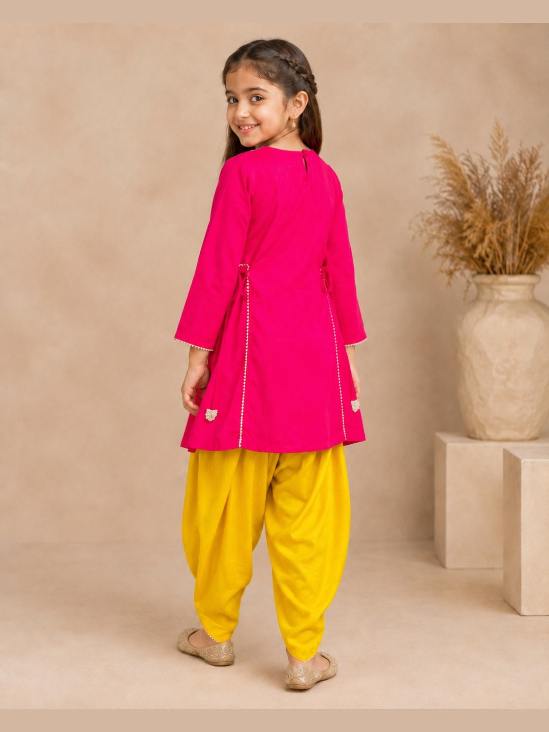 Bitiya By Bhama Girls Pink Embroidered Kurta With Mustard Dhoti Set.