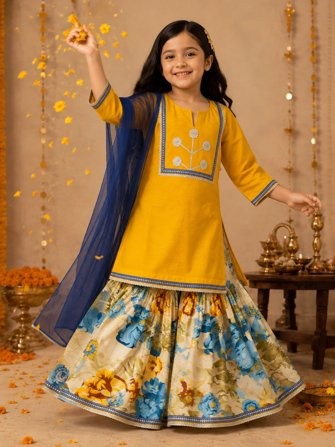 Bitiya By Bhama Girls Mustard Kurta With floral Printed Sharara And Blue Dupatta.