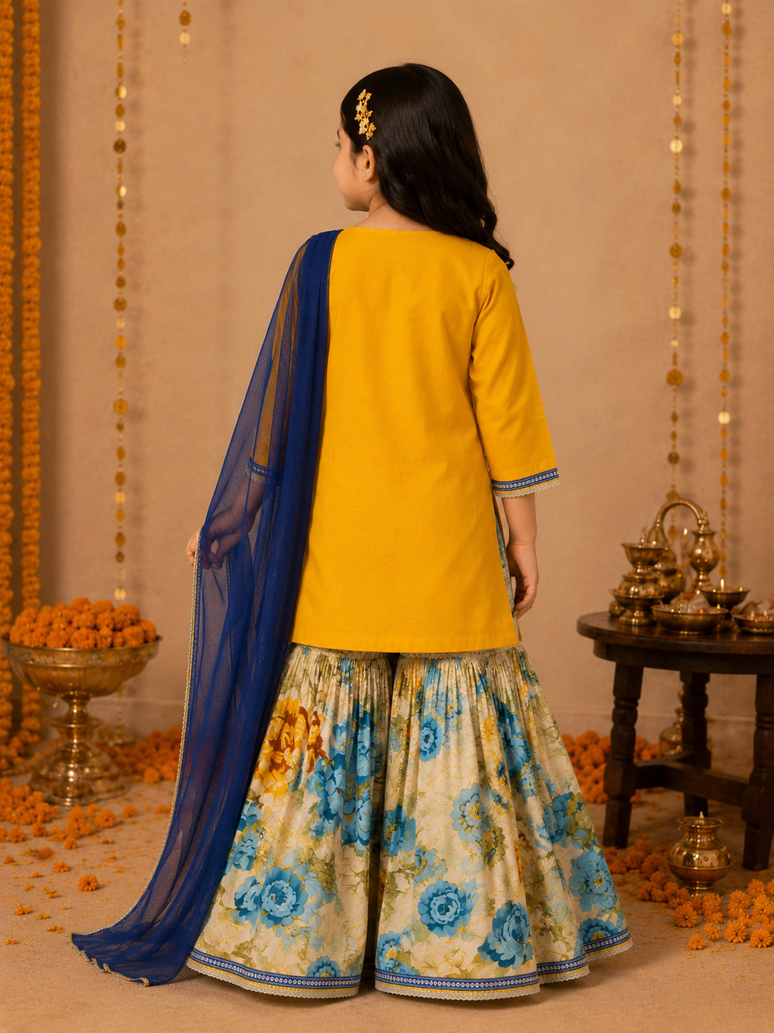 Bitiya By Bhama Girls Mustard Kurta With floral Printed Sharara And Blue Dupatta.