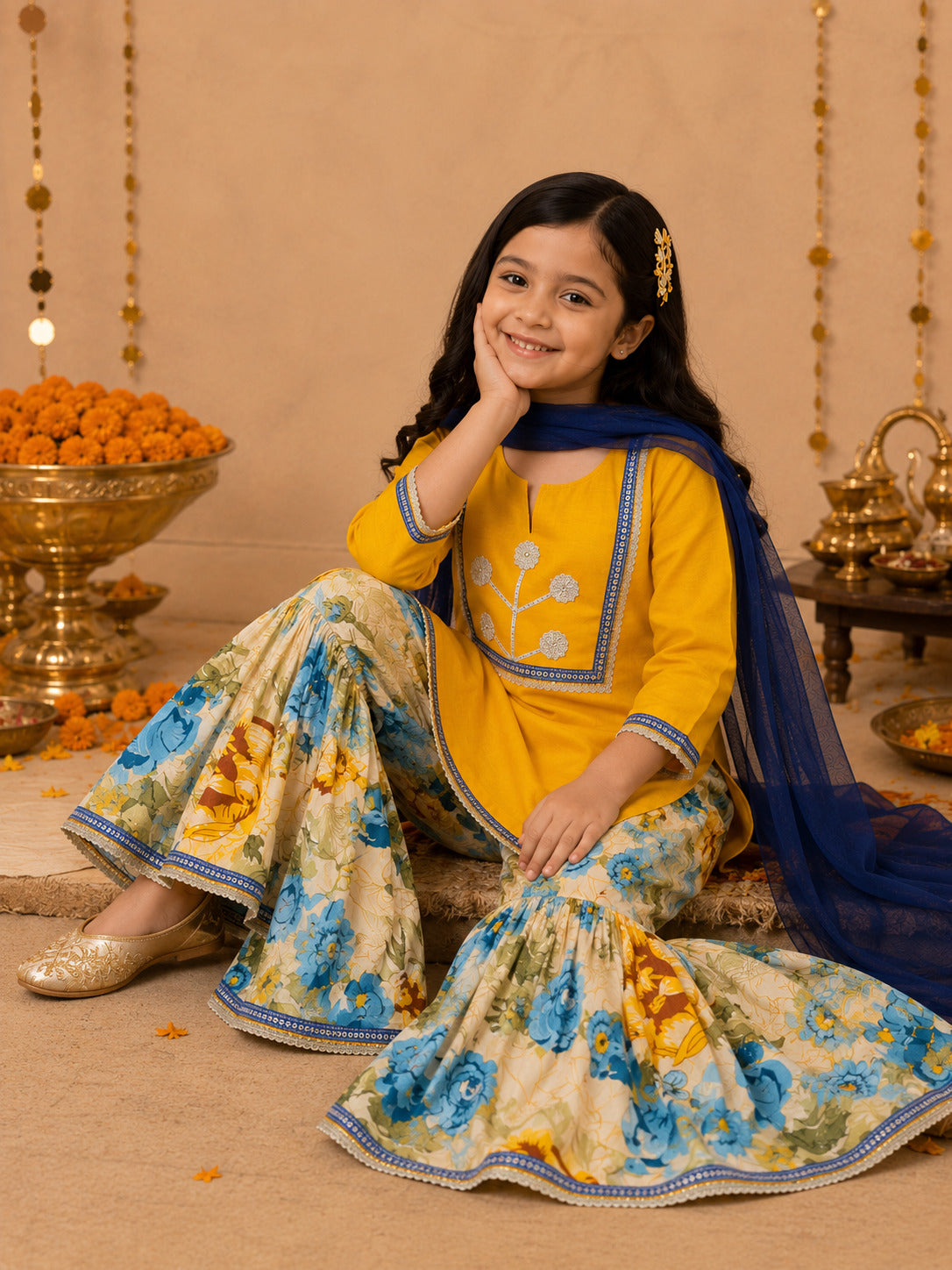 Bitiya By Bhama Girls Mustard Kurta With floral Printed Sharara And Blue Dupatta.