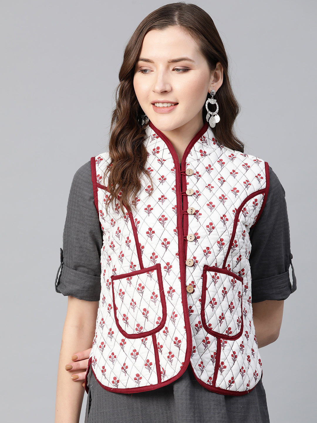 Quilted Jacket In Printed Fabric, Has A White Lining And Mehroon Piping Detailing On Collar And Pocket,Has 2 Pockets And Mandarin Collor
