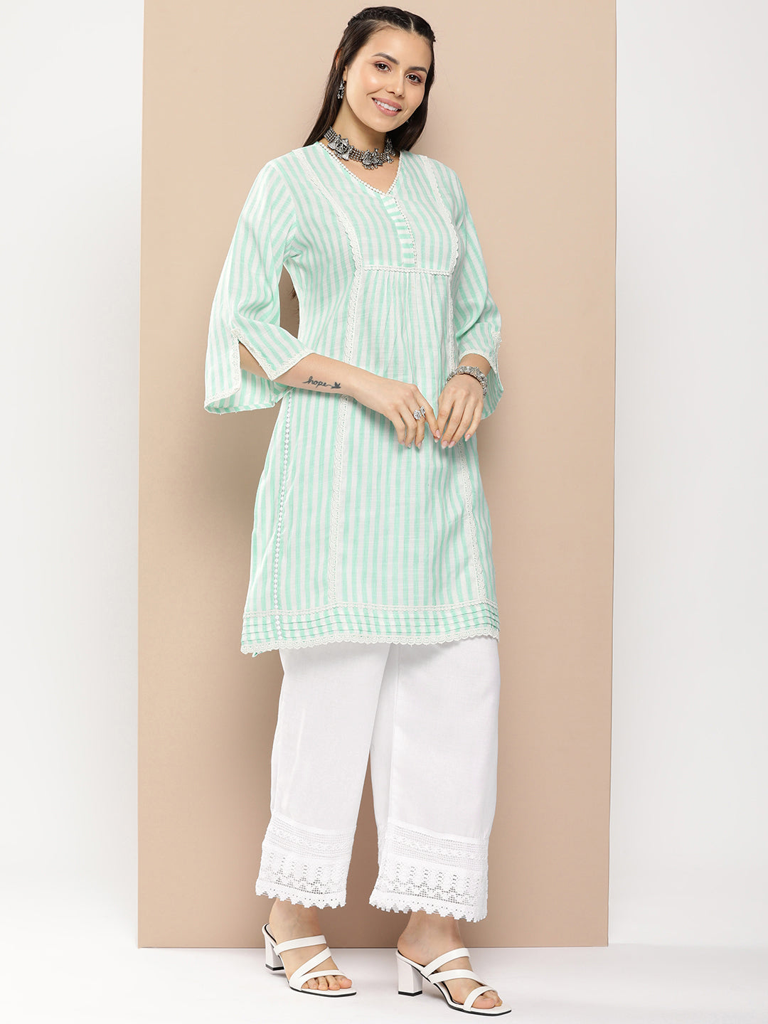 Bhama Couture Sea Green And White Striped Kurta With Lace Detailing & Off White Palazzos.