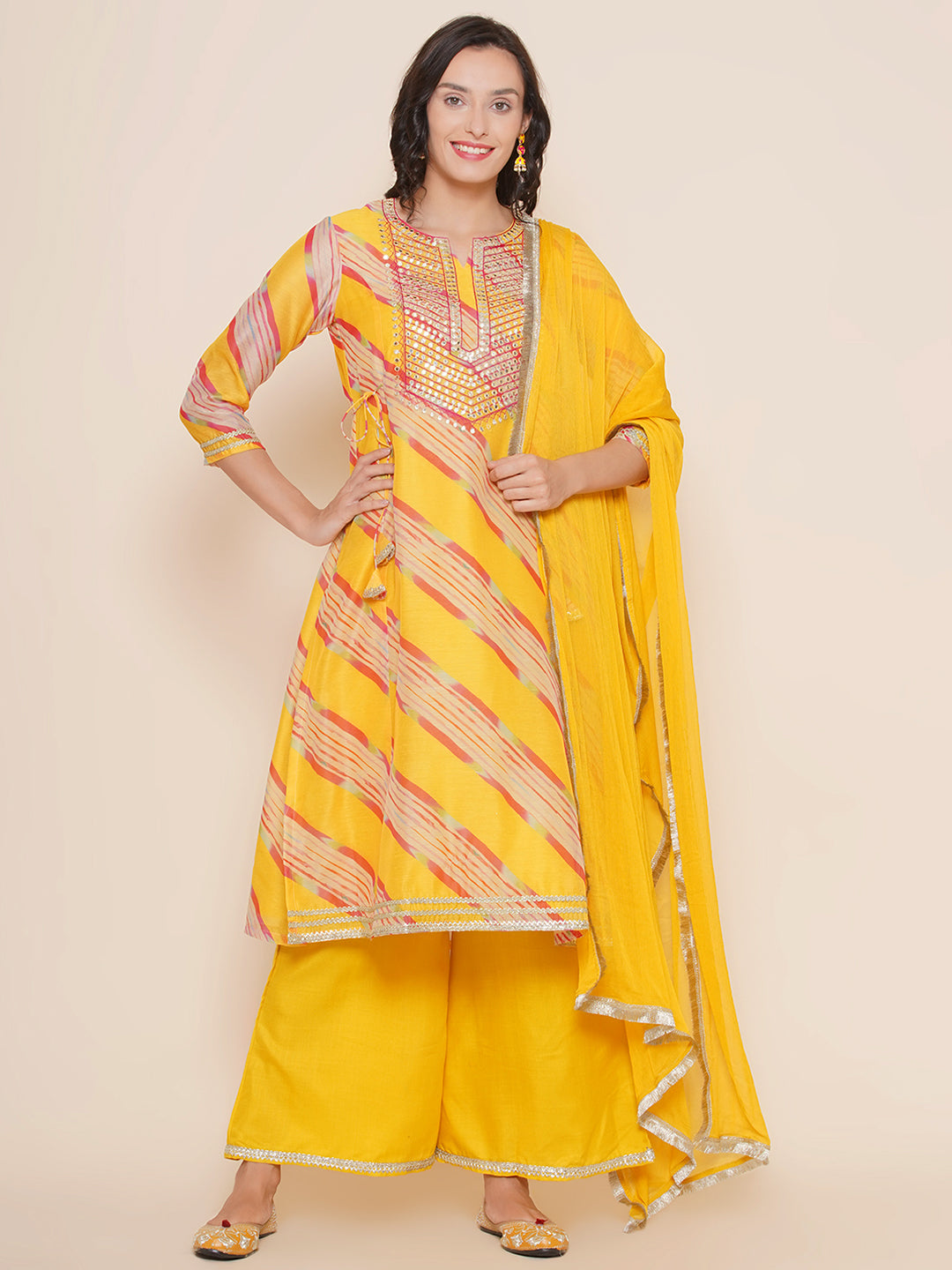 Bhama Couture Yellow Leheriya Printed Embroidered yoke A-Line Kurta & Yellow Solid Plazzos With Dupatta