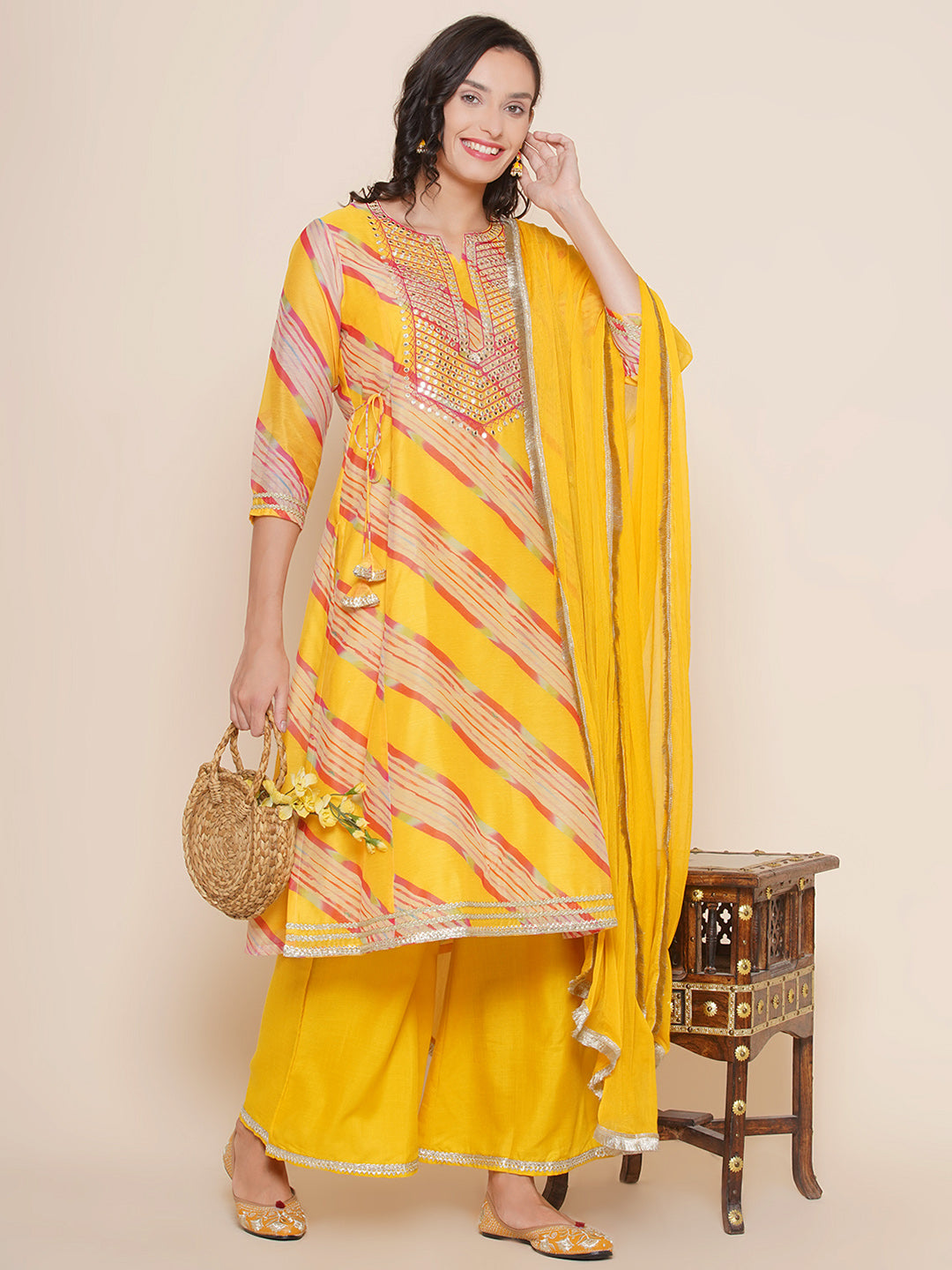 Bhama Couture Yellow Leheriya Printed Embroidered yoke A-Line Kurta & Yellow Solid Plazzos With Dupatta