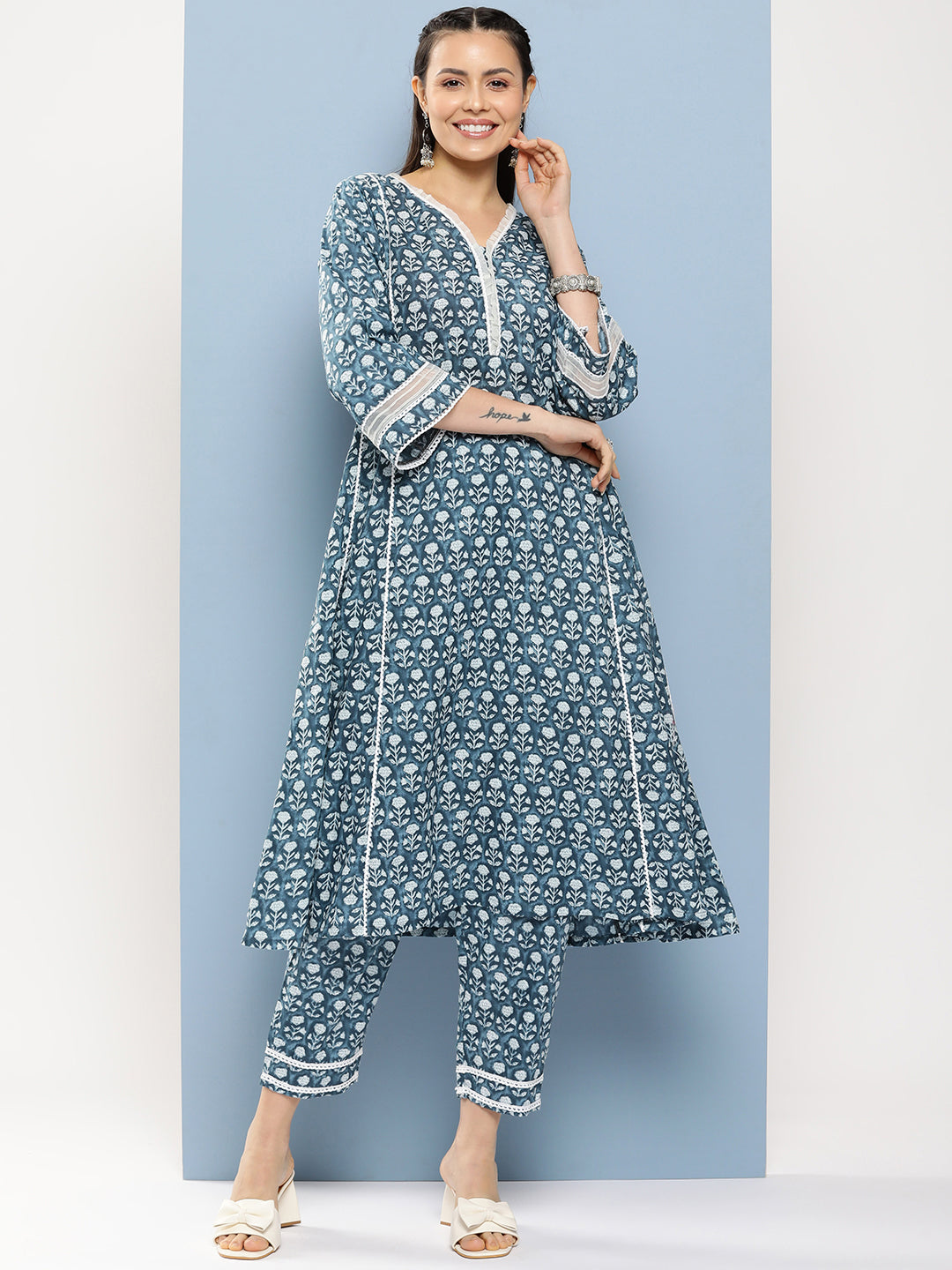 Bhama Couture Blue Floral Print A-Line Kurta With Lace Details & Blue Floral Print Palazzo.