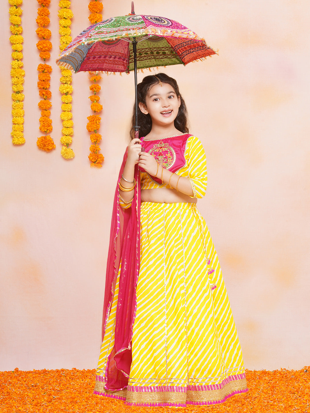 Bitiya by Bhama Girls Yellow Leheriya Printed Lehenga & Pink Embroidered Choli with Dupatta